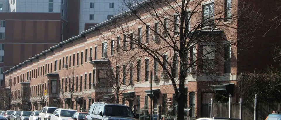 A row of brick and brownstone houses on South Oxford Street in Fort Greene, Brooklyn