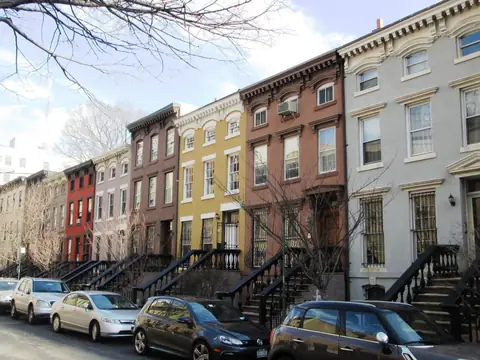 A row of attached Brooklyn row houses with stoops on St. Felix Street, Fort Greene