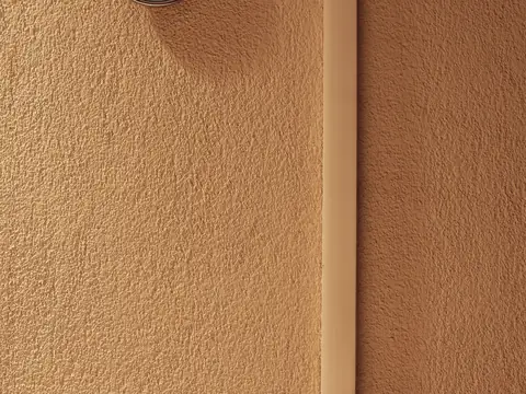 A round hygrometer on a wall, showing the room's humidity